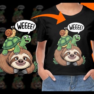 May include: A black t-shirt with a cartoon illustration of a sloth riding a turtle with a snail on top. The turtle is saying "WEEEE!" in a speech bubble.