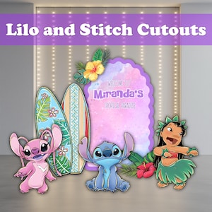May include: Cutouts featuring characters from Lilo & Stitch, including Angel, Stitch, and Lilo. The set includes two surfboards and a sign that reads "Welcome to Miranda's Tropical Paradise". The cutouts are in bright colors.
