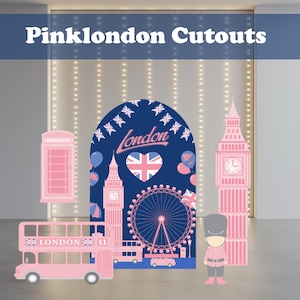 May include: Pink London Cutouts featuring a double-decker bus, Big Ben, a phone booth, and a London Eye Ferris wheel. The background is a navy blue arch with the word "London" and a Union Jack heart. A guard figure is also included.