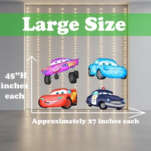 May include: Four cartoon car decals. The decals include a purple monster truck, a blue car, a red car, and a navy blue police car. The decals are approximately 69 cm each and 114 cm high. The words "Large Size" are at the top.
