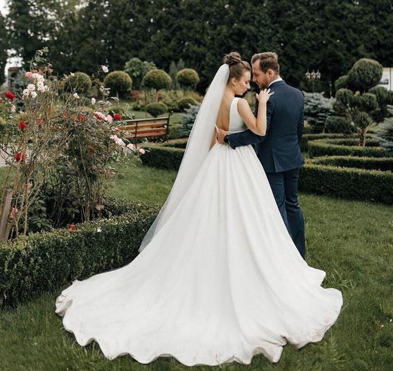 classic minimalist wedding dress 20 Simple Yet Striking Wedding Dresses For Minimalist Brides