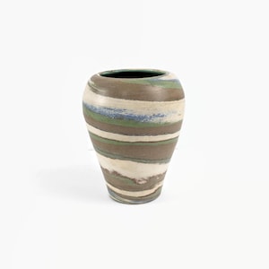 May include: A ceramic vase with a wide body and a narrow neck. The vase is decorated with horizontal stripes in shades of brown, white, blue, and green. The interior of the vase is dark green.
