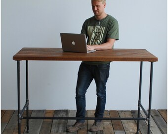 Standing Desk made with reclaimed wood and iron pipe legs.  Custom designs welcome.  Choice of size, height, wood thickness, and finish