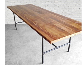 Reclaimed Wood Table with iron pipe legs. Choose thickness, size, height and finishes.  Custom orders welcome.