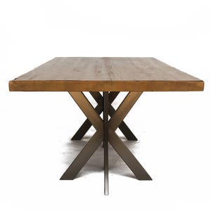 Modern Solid Wood Dining Table or Conference Table made with reclaimed wood and steel intersections pedestal style base.