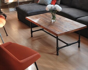 Wood Coffee Table with steel pipe legs made of reclaimed wood.  Choose size, top thickness and finish.