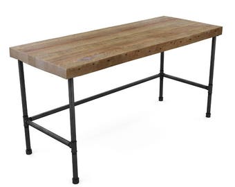 Industrial Desk made with reclaimed wood top and iron pipe legs.  Choice of size, thickness and finish.