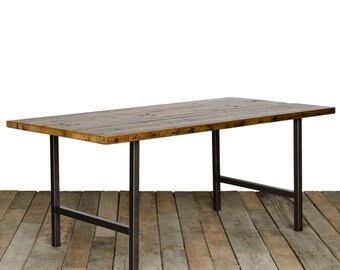 Rustic Dining Table with 1.5" reclaimed wood top and modern H frame steel legs in choice of sizes, finish. Casters avaiable at request.