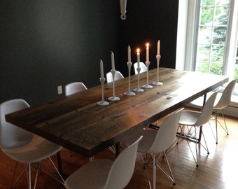 Industrial Chic Reclaimed Wood Table made with steel U shaped legs.  Choose size, thickness and finish.