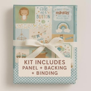 May include: A baby-themed kit wrapped with a white ribbon. The kit features a light blue and white gingham pattern on the edges and a patchwork design with illustrations of a lion, a train, and text that reads "cute as a button" and "welcome to the world".