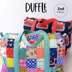 May include: Two patchwork duffle bags. The front bag has a colorful patchwork design with a light blue handle. The text "PATCHWORK DUFFLE" is at the top. The second bag is behind the first bag.