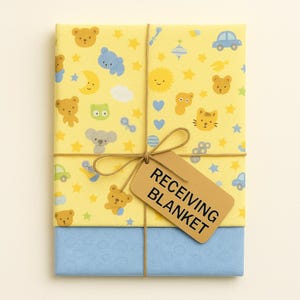 May include: A receiving blanket wrapped in yellow paper with a repeating pattern of cartoon animals and stars. The blanket is tied with twine and a brown tag that reads "RECEIVING BLANKET". The bottom portion is wrapped in blue paper.