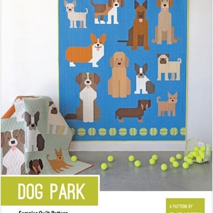 May include: A blue quilt featuring various dog breeds in a patchwork design. The quilt has a green border and is decorated with yellow tennis ball accents. The words "DOG PARK" are displayed on a green banner. A sampler quilt pattern.
