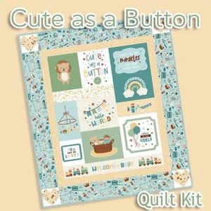 May include: A baby quilt kit with a patchwork design. The quilt features squares with images of a lion, a rainbow, a mobile, and a basket of toys. Text includes "Cute as a Button", "Hello World", and "Welcome Baby". The quilt is bordered with a light blue pattern.