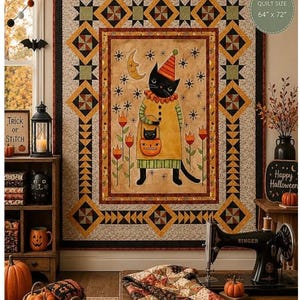 May include: A rectangular quilt measuring 64 inches by 72 inches featuring a central illustration of a black cat wearing a party hat and yellow tunic, holding a pumpkin bucket. The border displays geometric star and diamond patterns in orange, black, and green.