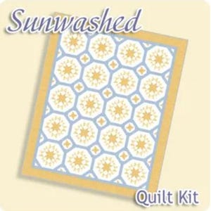 May include: A quilt kit with a geometric pattern of yellow starbursts on a light blue background. The quilt is framed with a yellow border. The words "Sunwashed" and "Quilt Kit" are printed on the image.