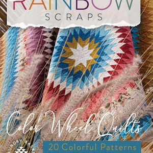 May include: A book cover for "Rainbow Scraps" by Laundry Basket Quilts. The cover features a colorful quilt with a starburst design in shades of blue, red, and white. The text "Color Wheel Quilts" and "20 Colorful Patterns" are also visible.