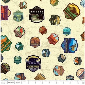 May include: Fabric featuring a repeating pattern of colorful national park patches. The patches showcase illustrations of mountains, wildlife, and park names like Yosemite, Glacier, and Great Smoky Mountains. The background is a textured, off-white color.