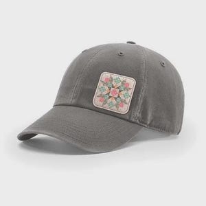 May include: Gray baseball cap with a square patch featuring a floral quilt design in pink, green, and cream colors. The cap has a curved brim and a classic six-panel construction.