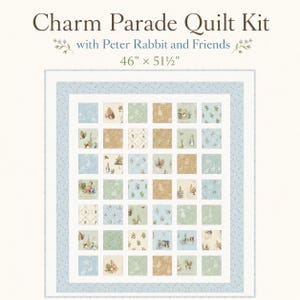 May include: A Charm Parade Quilt Kit with Peter Rabbit and Friends, measuring 46 inches by 51.5 inches. The quilt features a grid of square fabric patches in shades of blue, green, and tan, decorated with Peter Rabbit illustrations and patterns.
