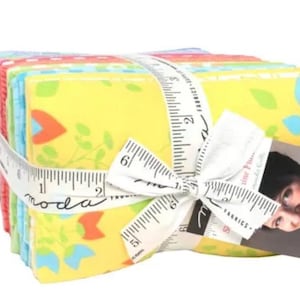 May include: A bundle of 10 fat quarter fabric squares in a variety of bright colors and patterns. The fabric features a floral design with yellow, blue, red, and green accents. The fabric is tied together with a white ribbon and a measuring tape that reads "moda".