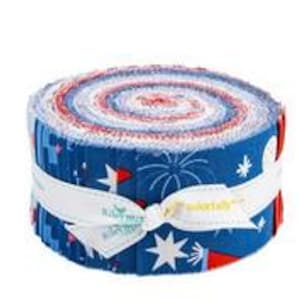 May include: A tightly rolled fabric bundle featuring a patriotic design. The fabric roll displays a spiral of red, white, and blue patterns, secured with a white ribbon. The outer layer showcases a blue print with fireworks and star motifs, perfect for quilting or crafting projects.