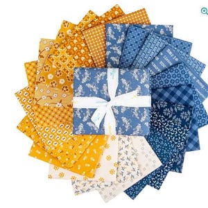 May include: A collection of square fabric swatches arranged in a circular fan pattern, tied with a white ribbon. The fabric features various patterns including floral, geometric, and plaid designs in shades of mustard yellow, cream, and navy blue.