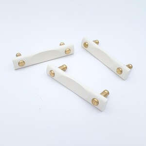 Vintage cabinet handle | Beslag Design Joker Pulls | White painted oak and brass | Sweden | Scandinavian hardware