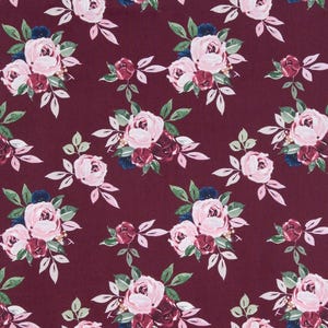 May include: A fabric pattern featuring a repeating floral design on a deep burgundy background. The print consists of clusters of light pink roses, smaller dark red rosebuds, and dark green leaves arranged in a consistent, spaced layout.