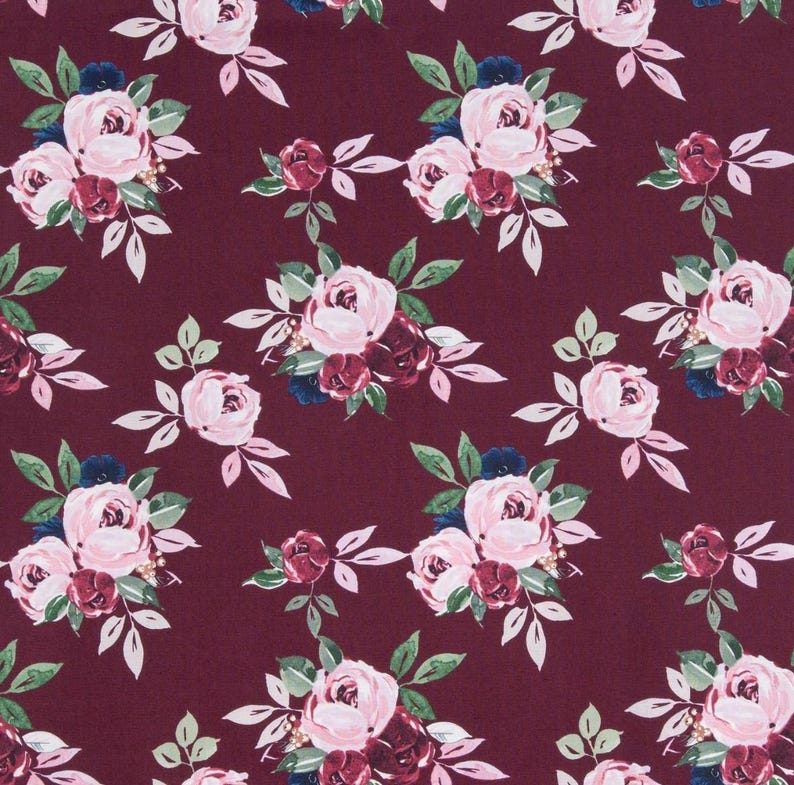 May include: A fabric pattern featuring a repeating floral design on a deep burgundy background. The print consists of clusters of light pink roses, smaller dark red rosebuds, and dark green leaves arranged in a consistent, spaced layout.