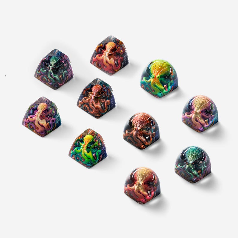 May include: Ten colorful keycaps featuring an octopus design. Each keycap is made of clear resin with a different color scheme and octopus design.