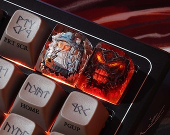 May include: Custom keyboard with artisan keycaps. One keycap features a detailed wizard design, and another depicts a fiery demon. The other keys are brown with white lettering, including "PRT SCR", "HOME", and "PGUP".