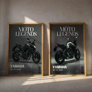 May include: Two framed posters featuring motorcycle images. The posters have a gold frame and a dark gray background. The text "MOTO LEGENDS MAGAZINE" is at the top, with "YAMAHA MT-07 2021" at the bottom. One poster shows the front of the motorcycle, the other shows the rear.