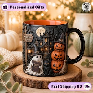 May include: A black ceramic mug featuring a 3D embossed Halloween scene with a haunted house, a ghost holding a book labeled Spells, a black cat, and a stack of three jack-o'-lanterns. A sign on the mug reads Sophia's House.