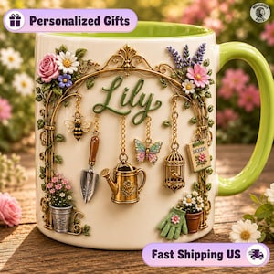 May include: A cream-colored ceramic mug with a light green interior and handle, featuring a raised garden-themed design. The mug displays the name Lily in green script, surrounded by a gold arch, a bee, a trowel, a watering can, a butterfly, a birdcage, a seed packet labeled SEEDS, and potted flowers.
