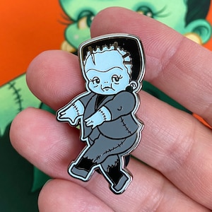 Boris the Wee Monster Babe Pin - Spoopy Glow-in-the-Dark Kewpie hard enamel badge by Stacey Martin Tattoos