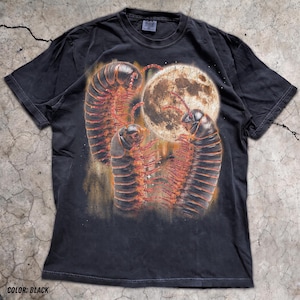 May include: A black short-sleeve t-shirt featuring a graphic print of three large centipedes with dark segmented bodies and orange legs. The centipedes are positioned around a large, textured, glowing full moon set against a dark background.