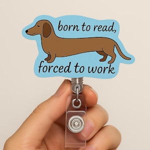 Bobine de badge drôle pour chien « Né pour lire, forcé de travailler », clip pour porte-carte d'identité teckel, cadeau mignon pour enseignants, bibliothécaires, infirmières ou amateurs de lecture