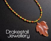 Carnelian and glass necklace with carved carnelian leaf pendant