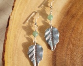 Jade beaded earrings with silver leaf pendants and silver accents