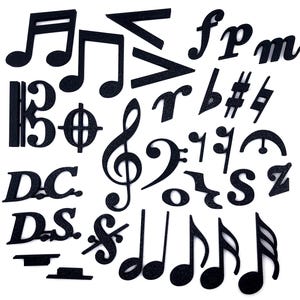 May include: A collection of black glittery musical symbols and notes, including treble clefs, bass clefs, and various note durations. The symbols are scattered across a white background, creating a visually engaging arrangement for music-themed projects.