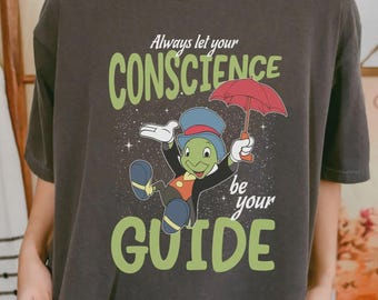 Camiseta Pepito Grillo: "Siempre deja que tu conciencia te guíe" con colores cómodos, camiseta de Pinocho de Disney, viaje familiar a Disneyland.