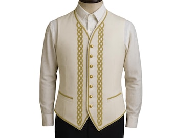 May include: Cream-colored vest with gold braided trim and gold buttons. The vest is worn over a white collared shirt. The vest has two small pockets and a tailored fit. The gold trim is a decorative element.