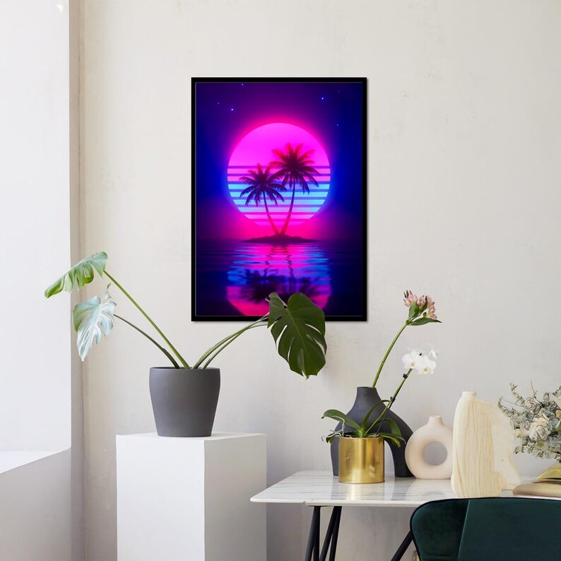 May include: A framed art print featuring a neon sunset scene with palm trees. The artwork showcases a vibrant pink and blue color palette, with the sun's reflection in the water. The image has a retro, vaporwave aesthetic.