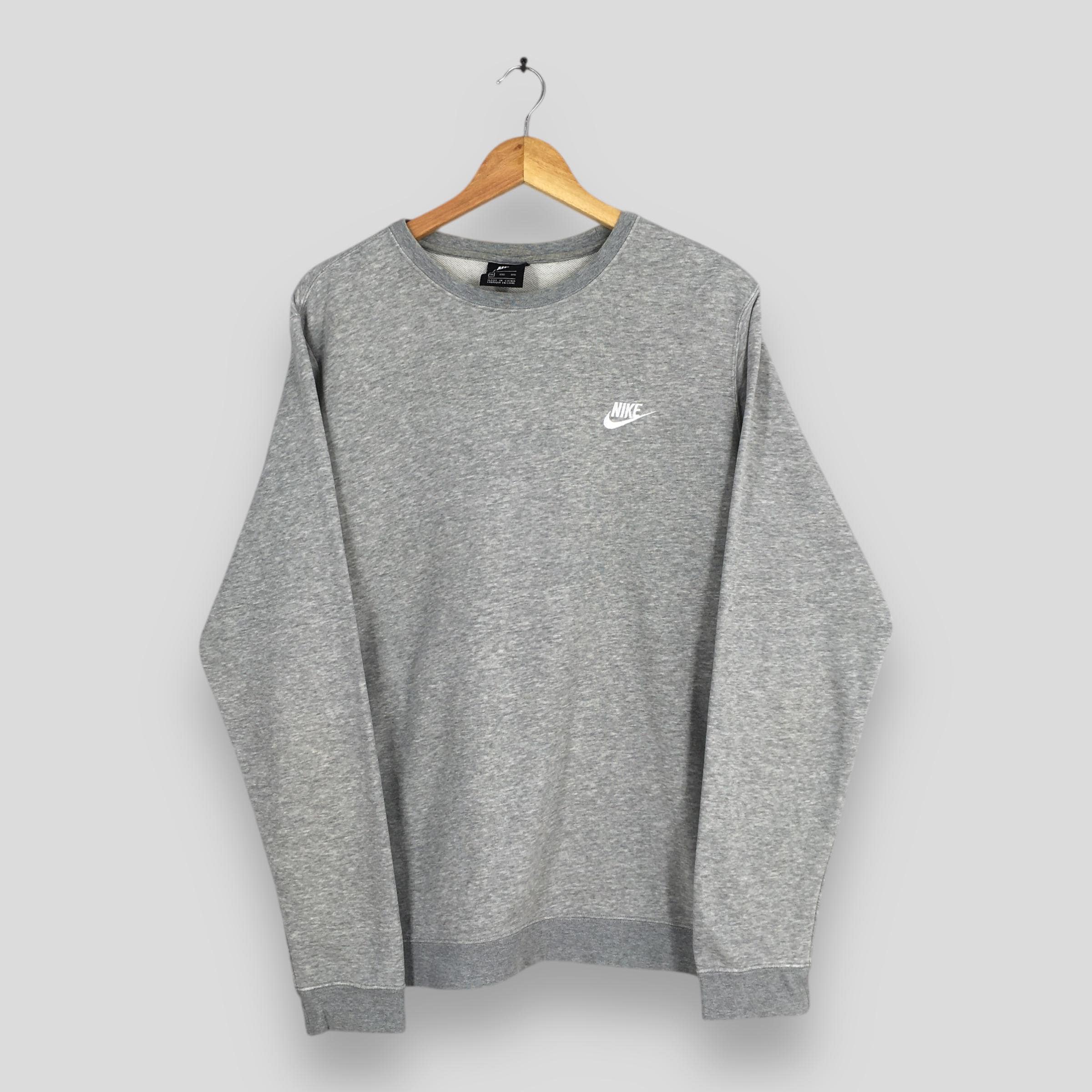 nike all over swoosh jumper