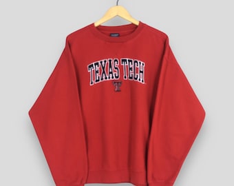 Sudadera vintage de fútbol americano de los Texas Tech Red Raiders, talla XL. Sudadera con el logo bordado de los Texas Tech Red Raiders. Cuello redondo de la Universidad Texas Tech, talla XL.