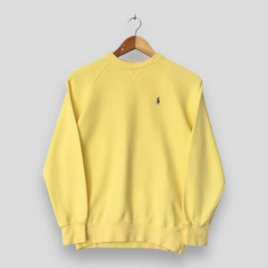 Sudadera amarilla vintage Polo Ralph Lauren Pony, talla M. Ropa con logo bordado de Ralph Lauren. Jersey Polo Pony Ralph Lauren. Suéter Polo RL M.