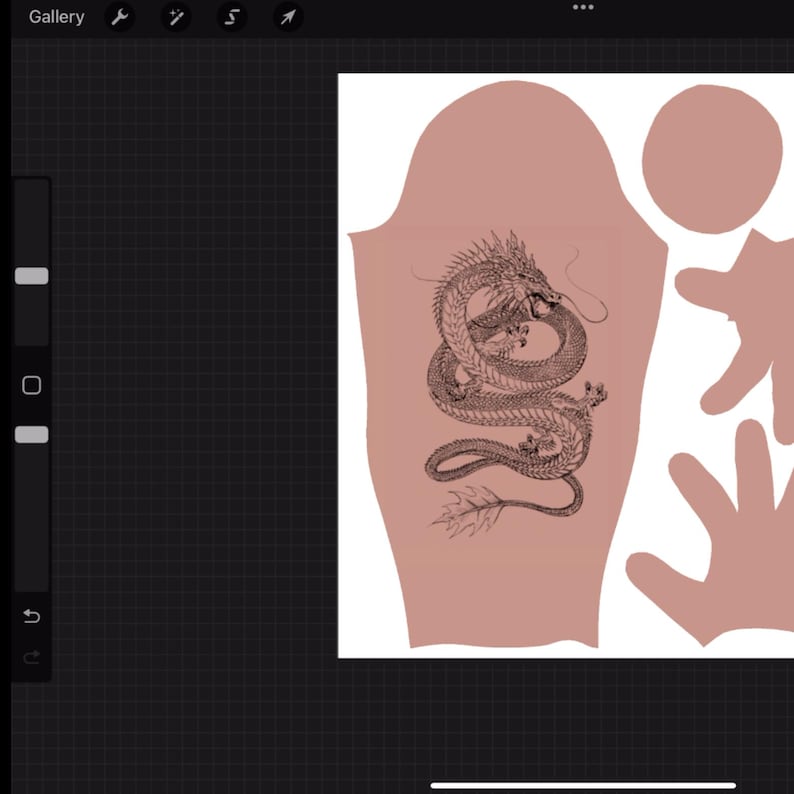 May include: A digital design template featuring a detailed black line art illustration of a coiled dragon centered on a dusty rose-colored fabric pattern piece, accompanied by additional rounded and hand-shaped fabric cutouts on a grid background.