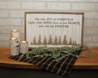 Christmas art & saying engraved on white washed background with rustic frame