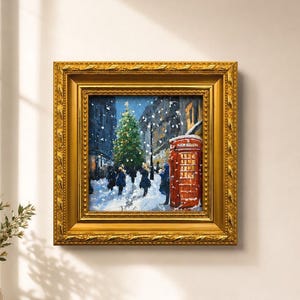 May include: A square oil painting in a decorative gold frame depicting a snowy city street scene at night. The artwork features a large illuminated Christmas tree, several figures walking through the snow, and a bright red British telephone box.